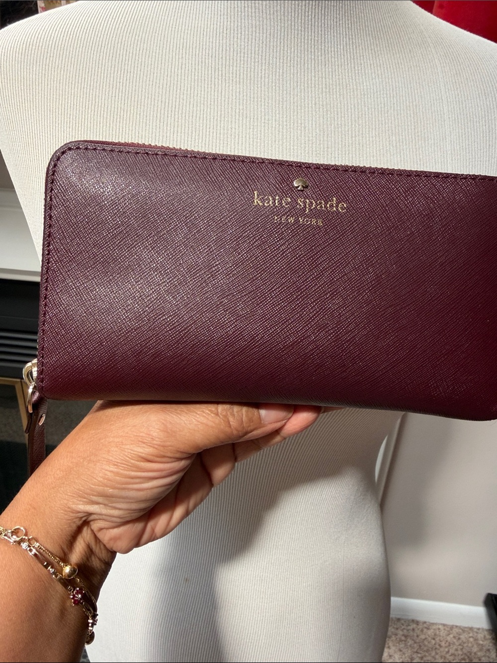 kate spade plum Saffiano zip-around wallet with gold logo